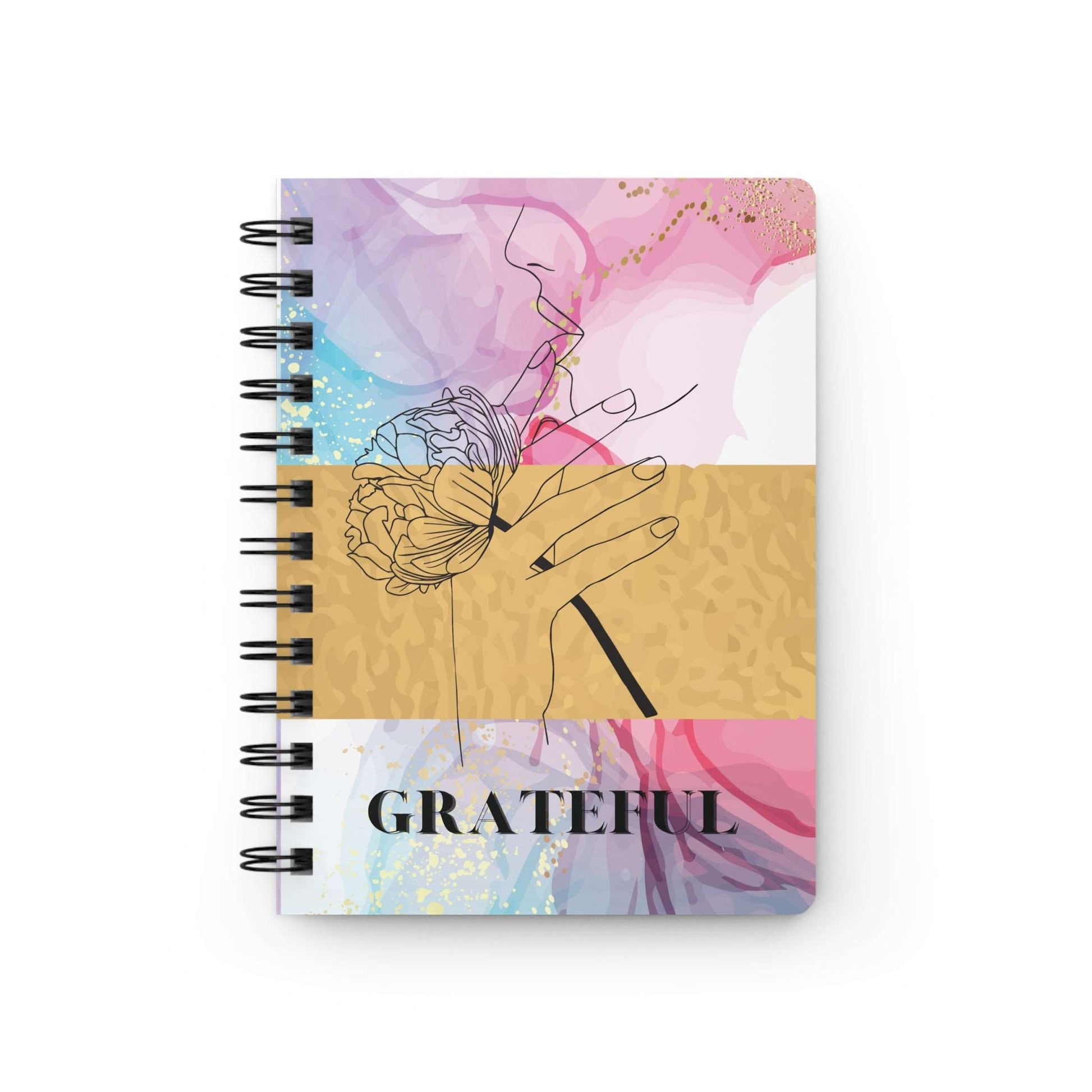 A colorful spiral notebook, the Grateful Journal, perfect for an attitude of gratitude.