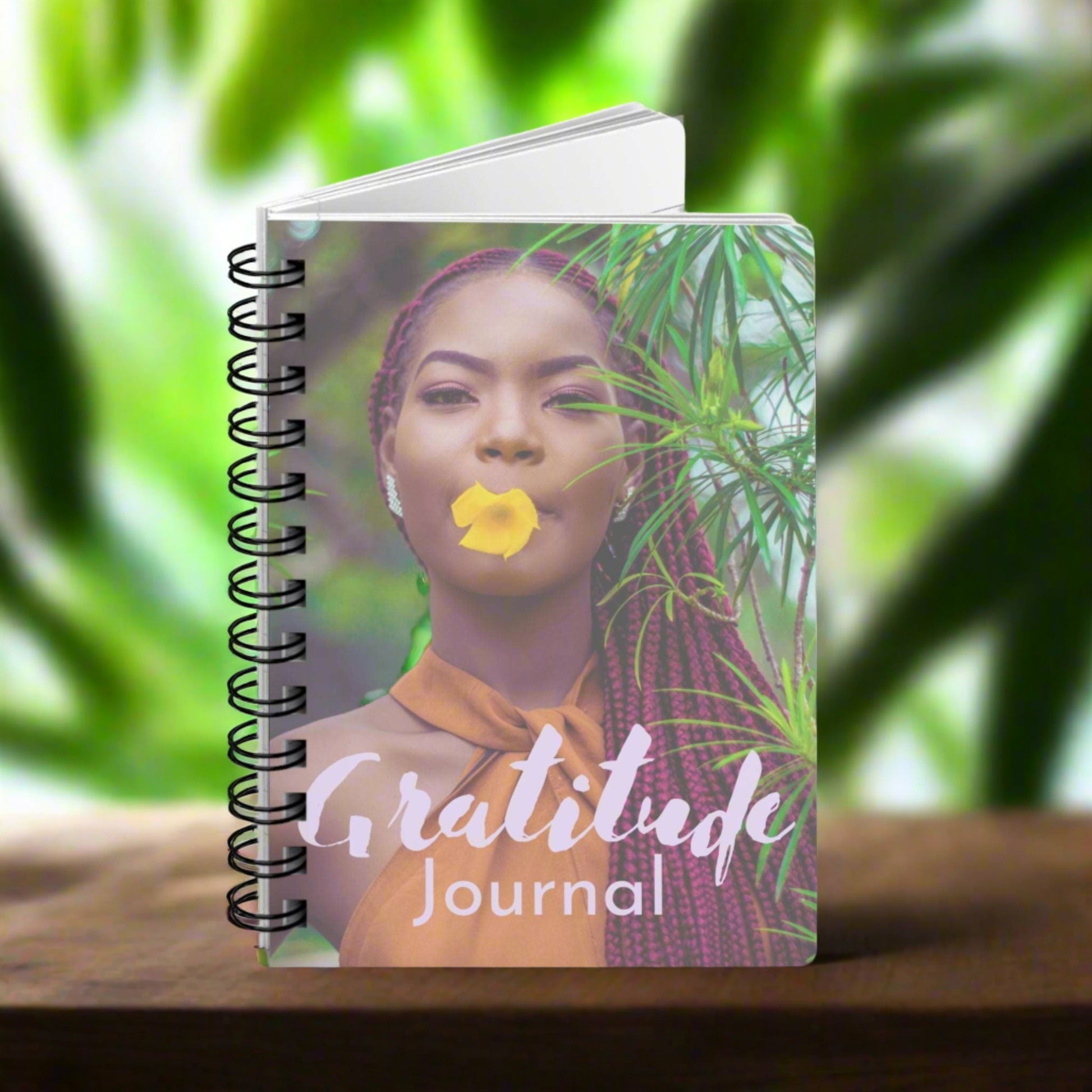A spiral notebook with the product name "Gratitude Journal : A Journal For Women" on it, perfect for a gratitude journal.