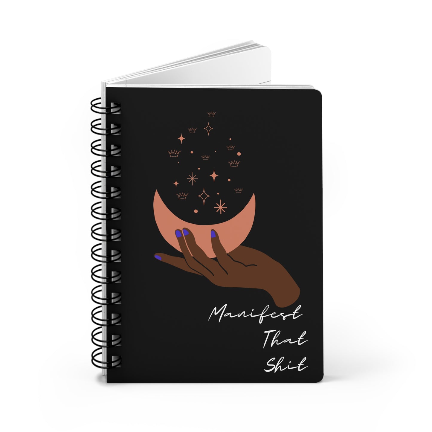 A black spiral notebook with a hand holding a moon and stars, perfect for "Manifest That Shit" Manifesting Journal to Access Your Inner Power.