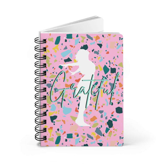 A pink spiral notebook with the product name Gratitude Affirmation Journal on it, perfect for gratitude journaling and positive affirmations.