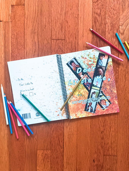 inner child healing journal on hardwood floor with colored pencils