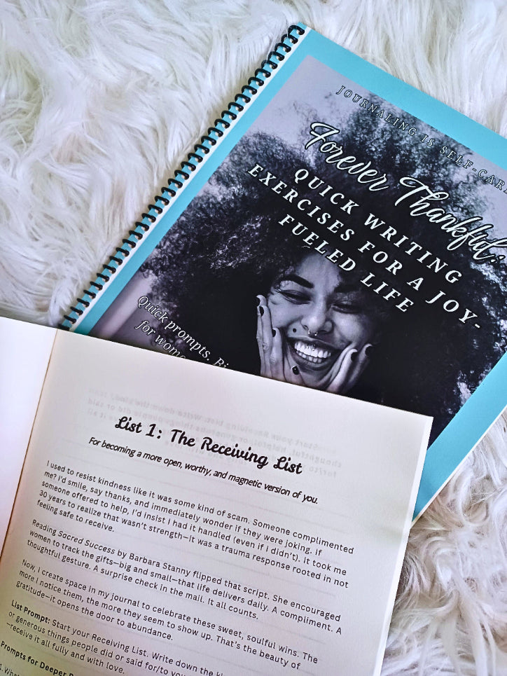 Open notebook with text and a photo of a woman on a fluffy white surface