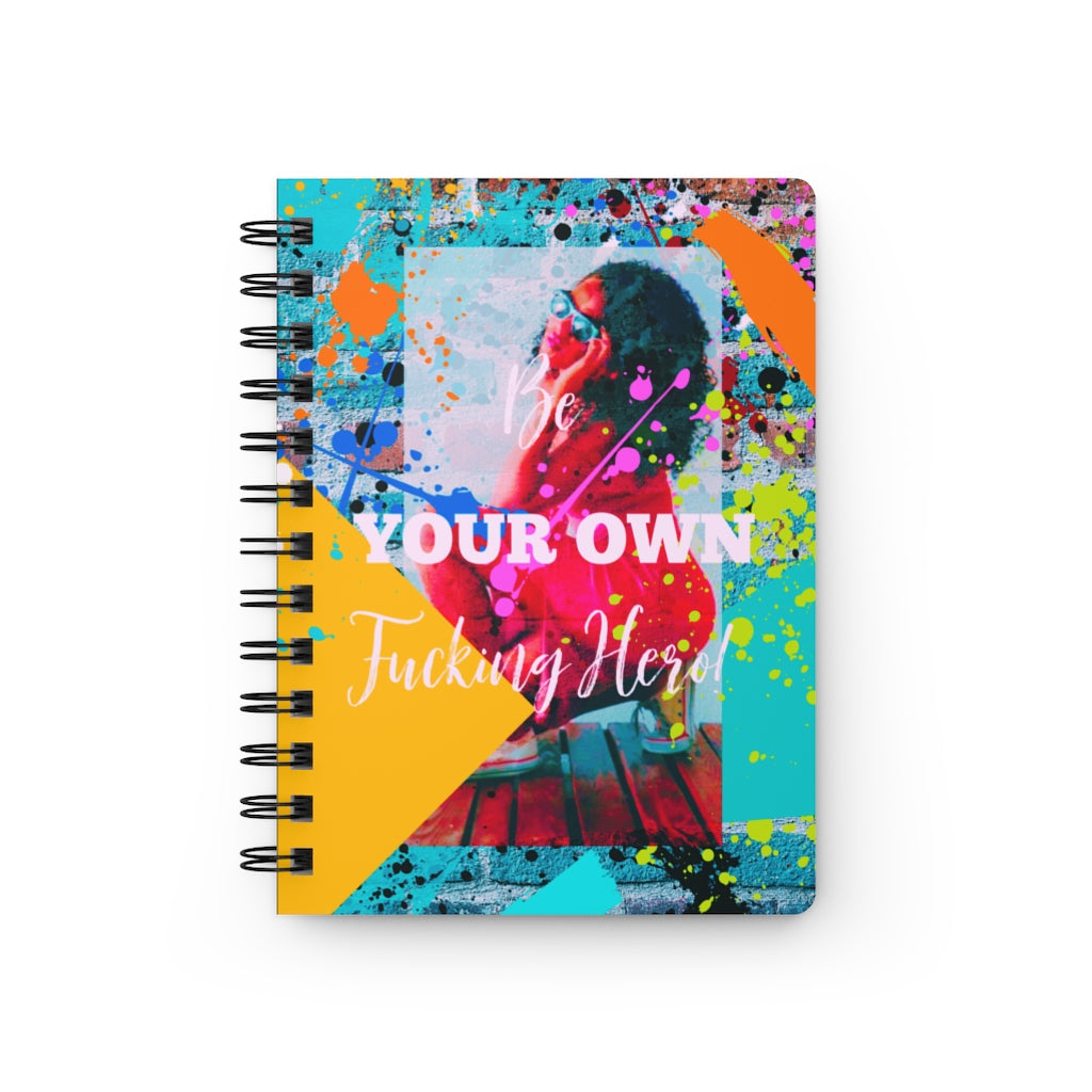 A "Be Your Own Fucking Hero" Spiral Bound Journal for Black Women with a colorful photo of a woman, perfect for self-reflection and embracing new beginnings.