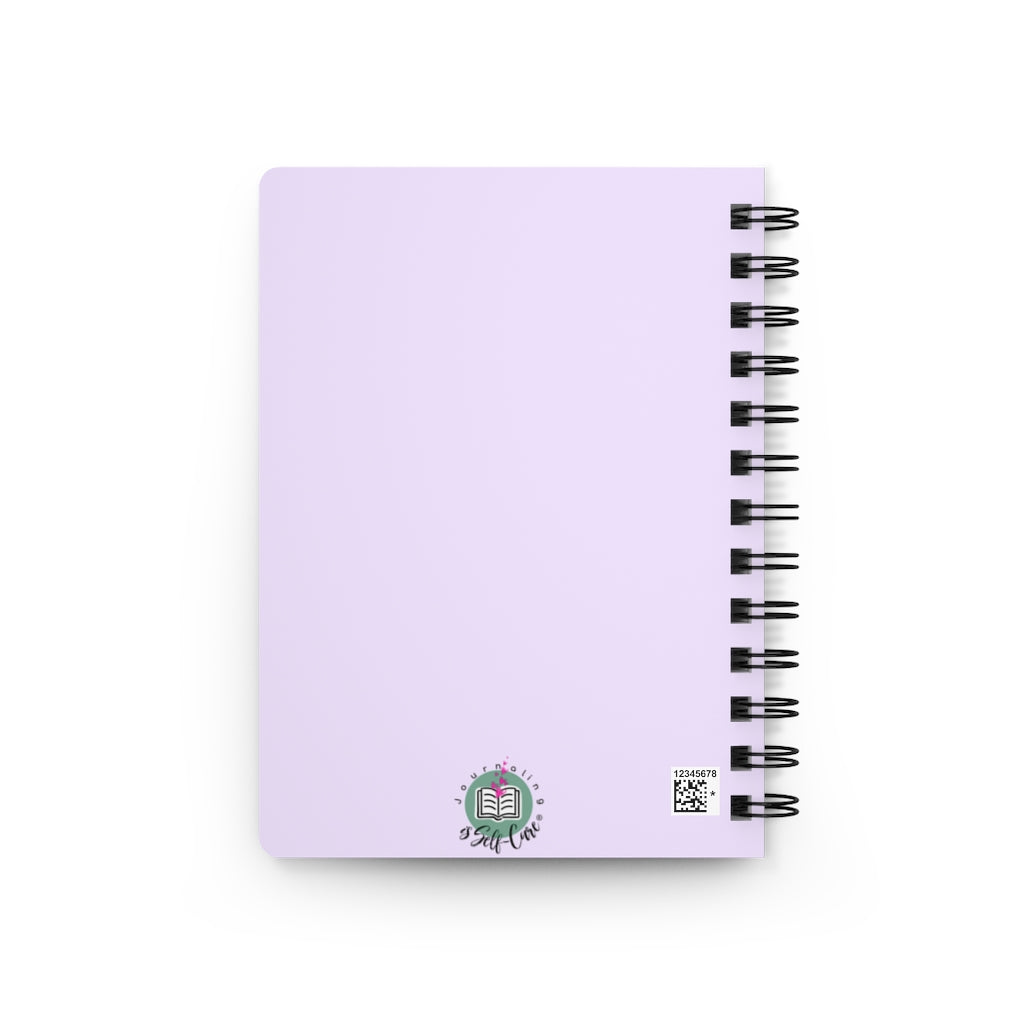 A purple spiral notebook with a flower on it, designed for women's empowerment. The "Blessed" Prayer Journal For Women contains lined paper with a stylish design on every page and thought-provoking prompts to inspire self.