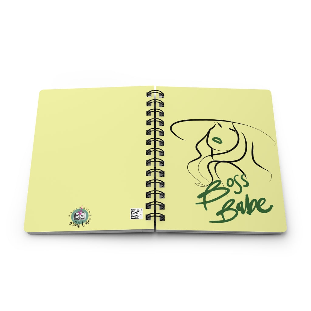 A yellow Boss Babe Journal for Self-Love with a drawing of a woman in a hat, perfect for journaling or goal setting.