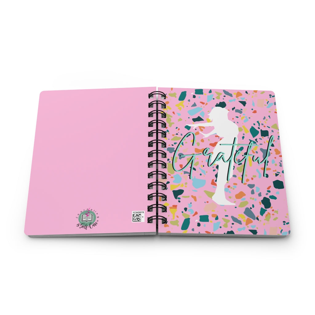 A pink spiral notebook with the product name Gratitude Affirmation Journal on it, perfect for gratitude journaling and positive affirmations.