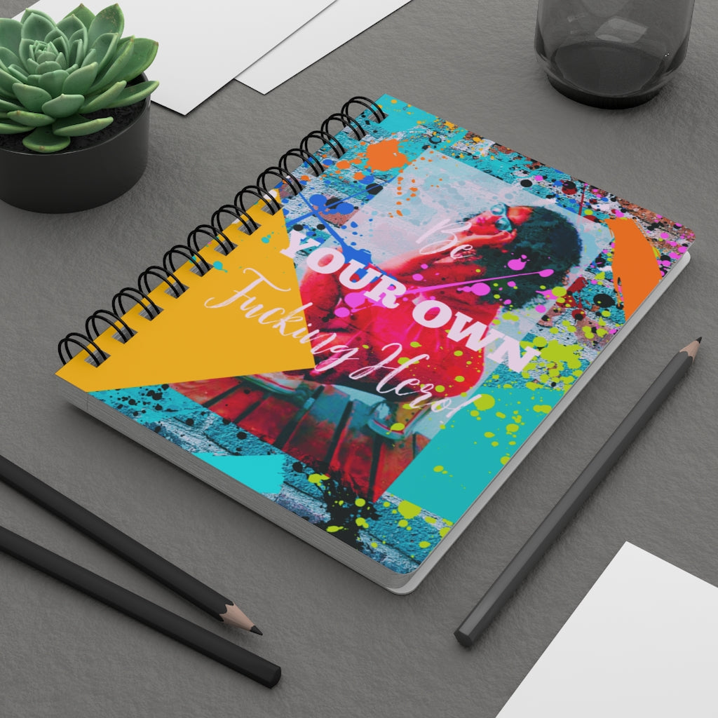 A "Be Your Own Fucking Hero" spiral bound journal for Black Women, perfect for starting a new beginning.