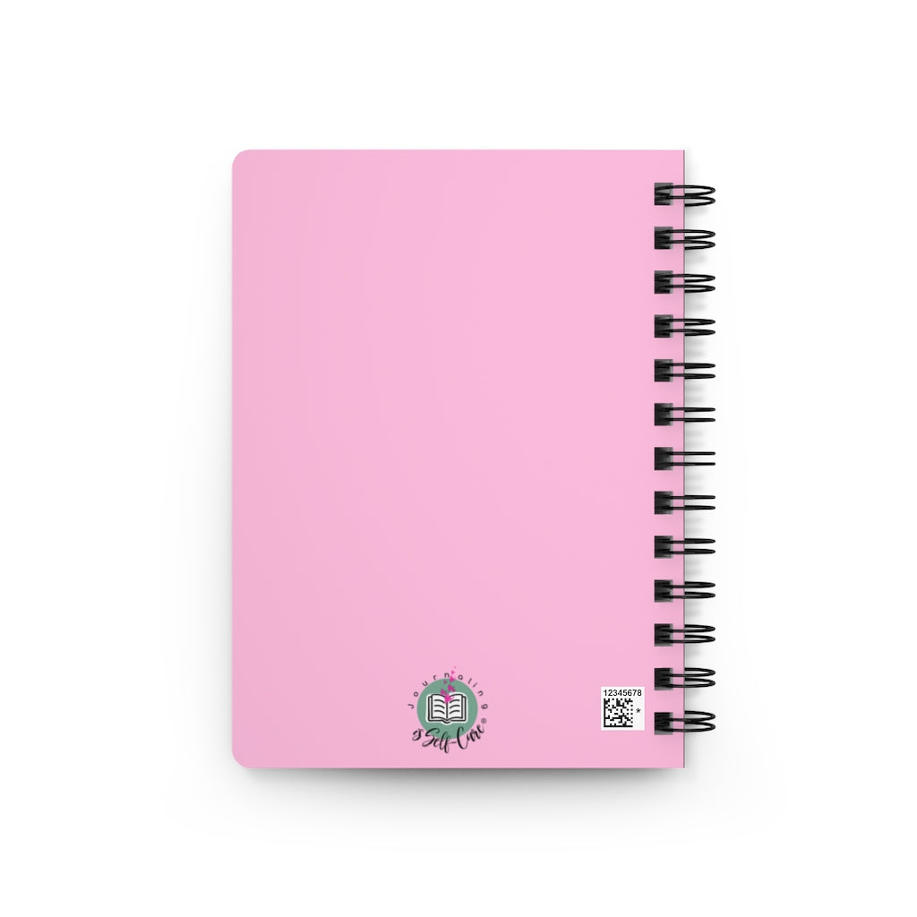 A pink spiral notebook on a white background, perfect for the Gratitude Affirmation Journal.